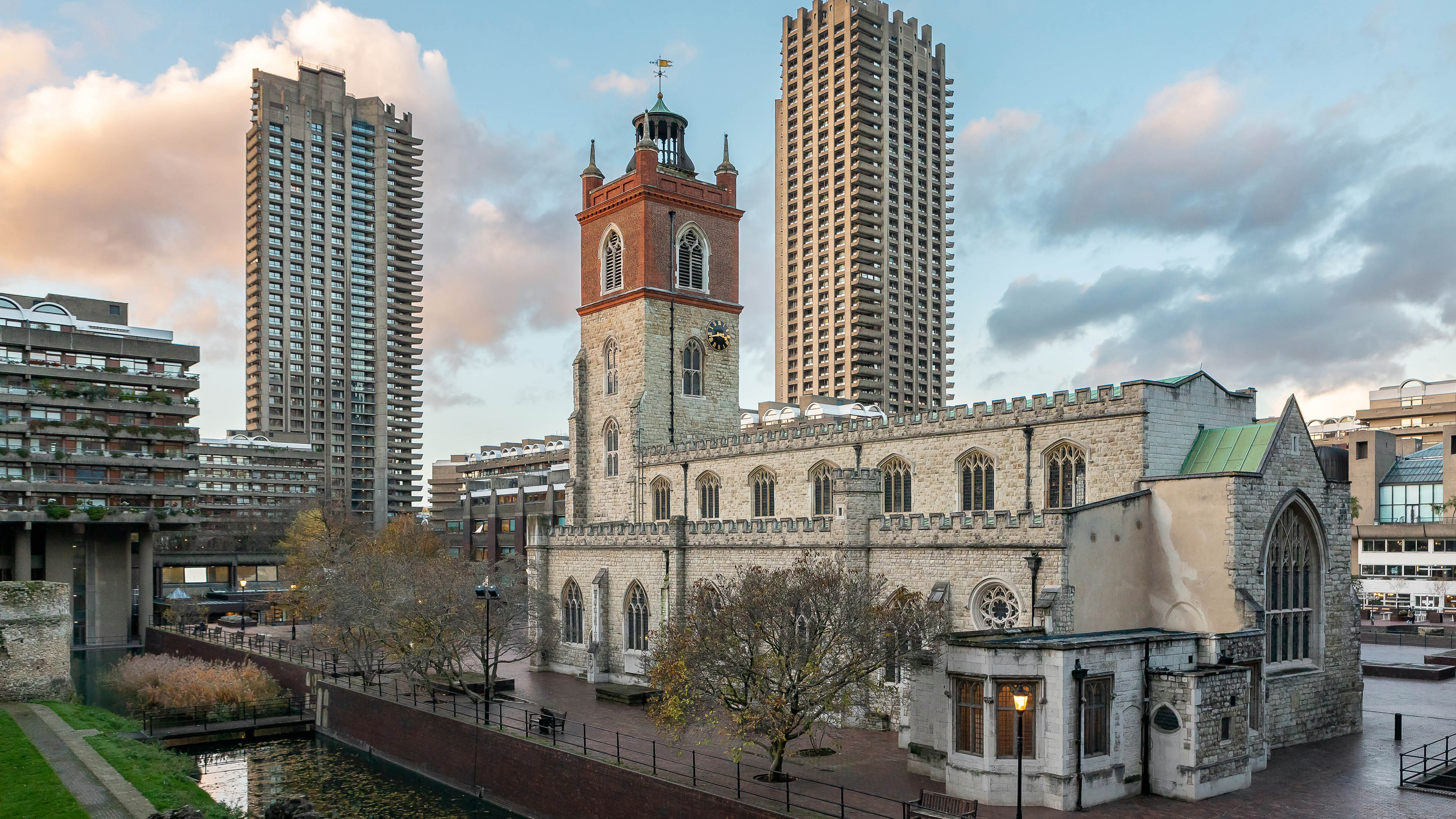 Medieval church surrounded by tower blocks