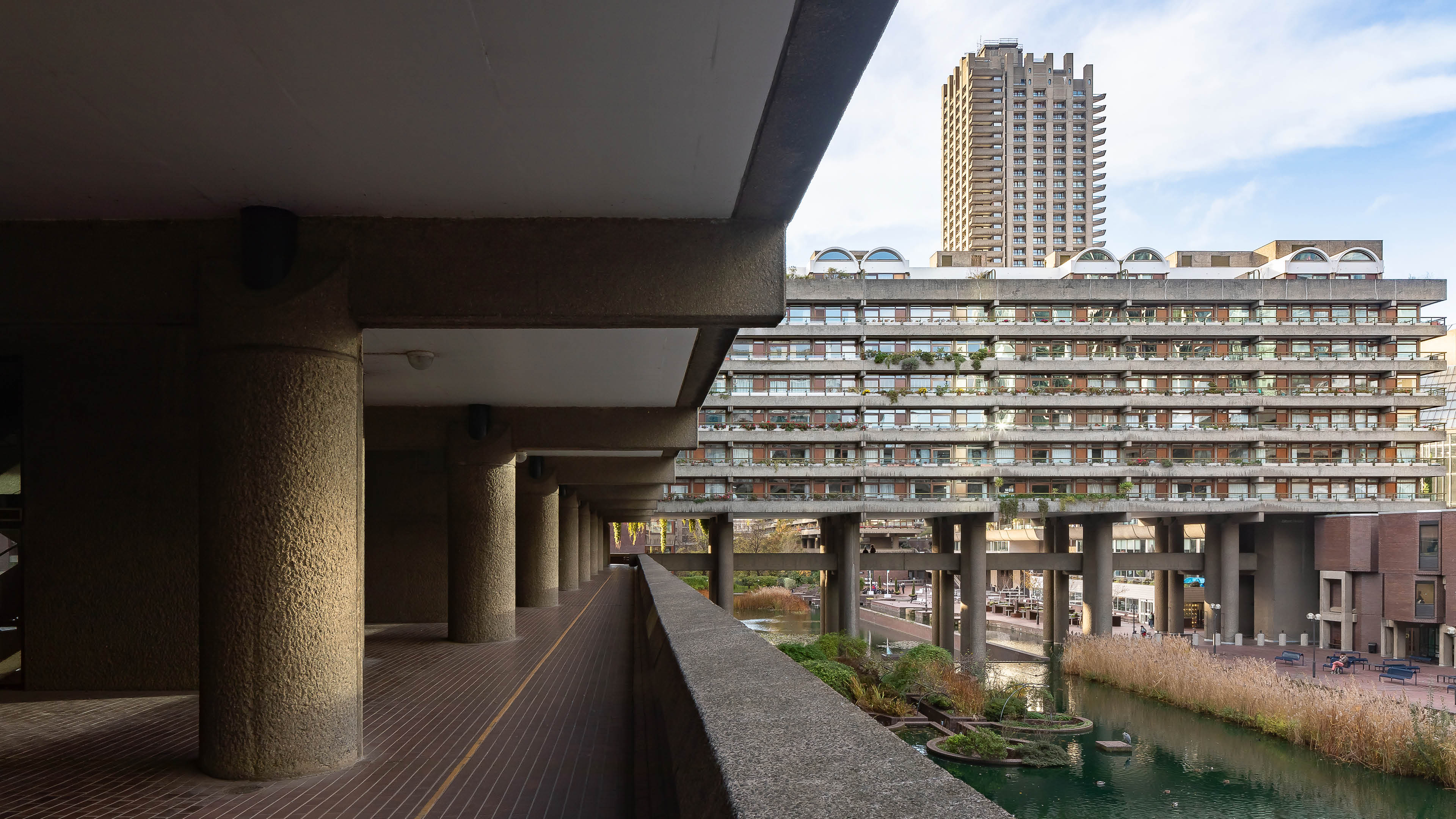 Looking down concrete walkway to residential building