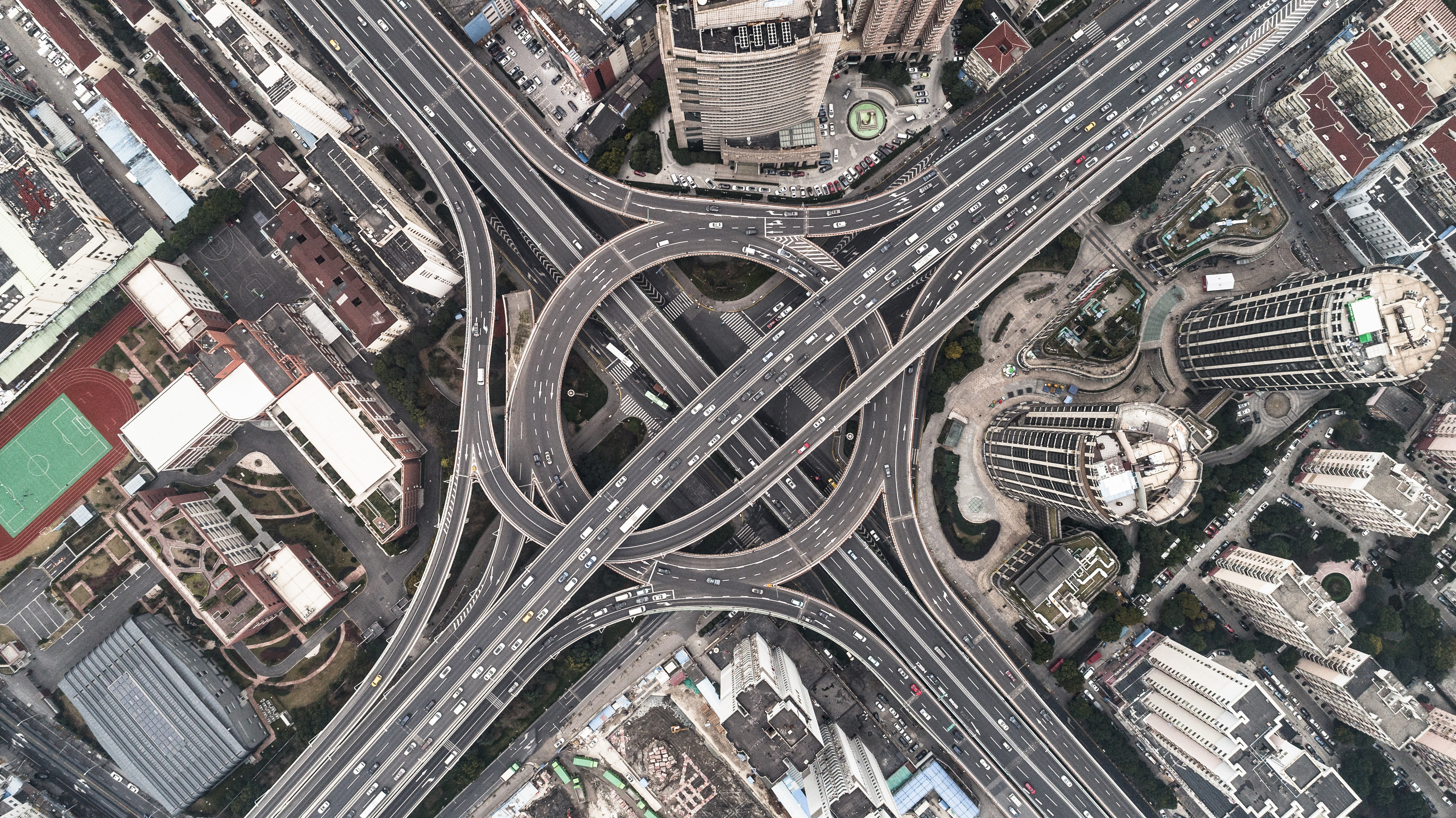 Aerial view of highway and overpass in city on a cloudy day
