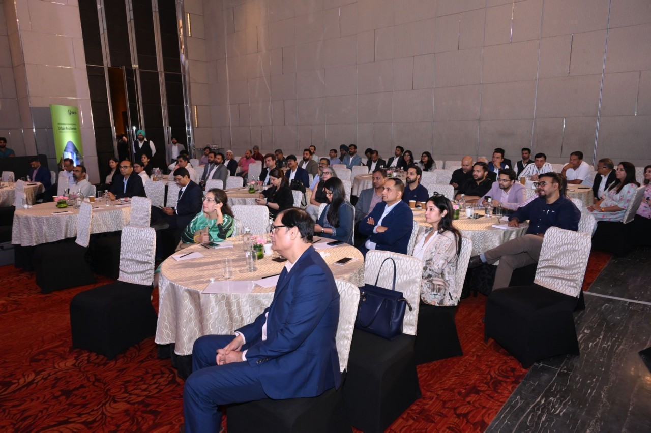 People sat down at a conference in India