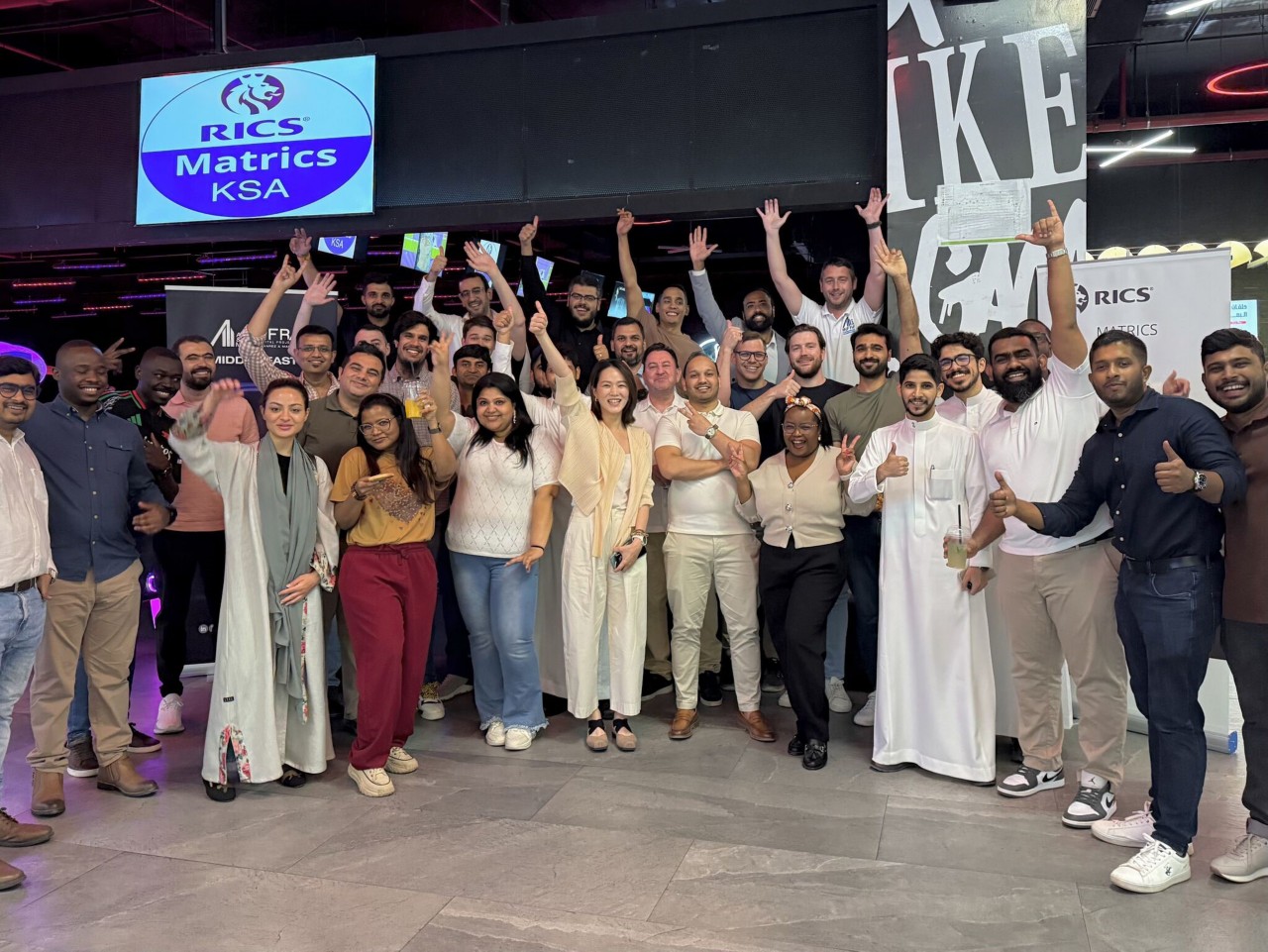 Large group of people posing for a photo at a conference