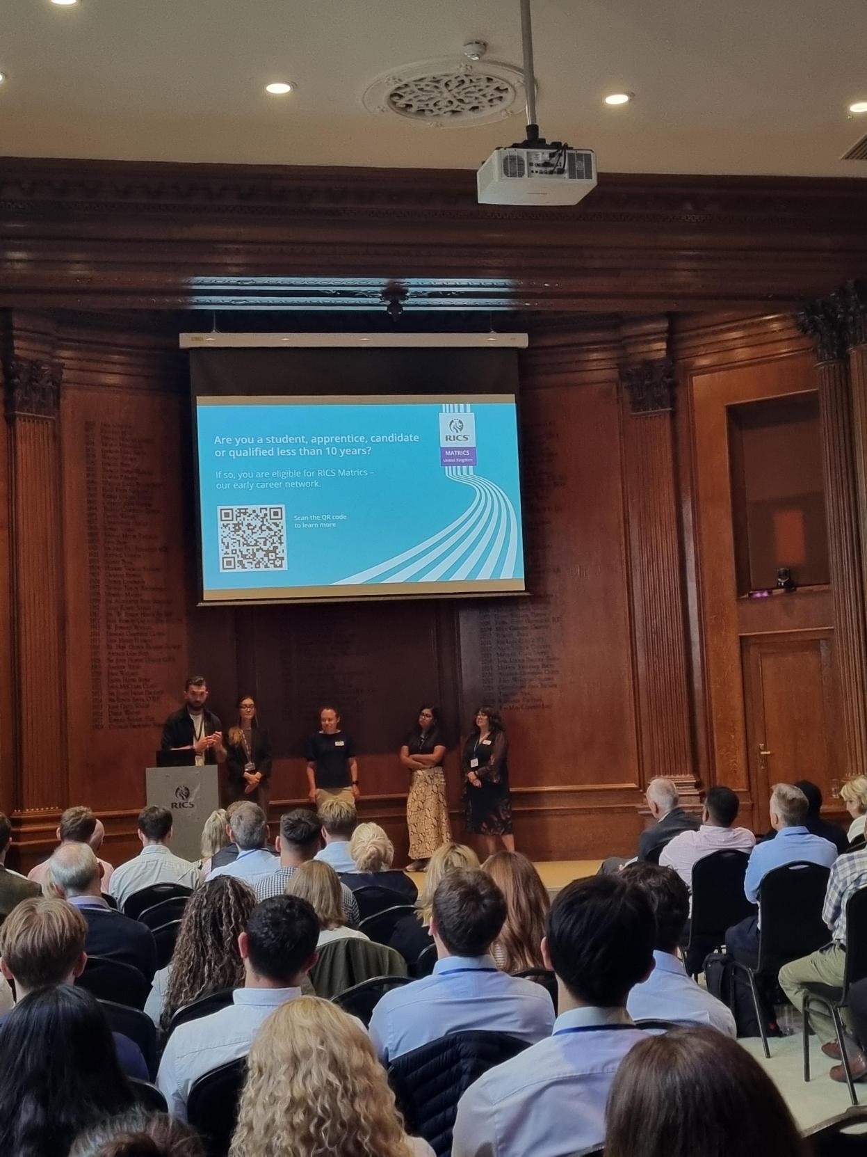 Large group of people posing for a photo at a conference