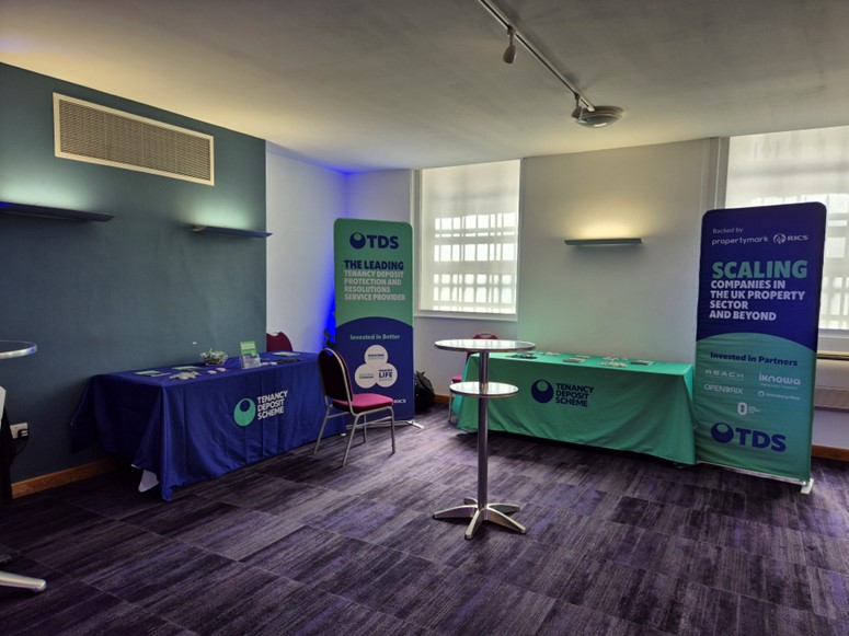 UK & Ireland Residential Property Conference 2024 conference hall with tenancy deposit scheme advert 