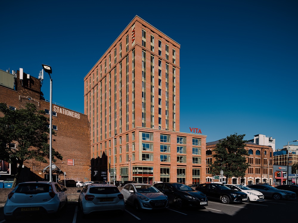 Image of tall building with cars parked in front, located at Bruce Street in Belfast