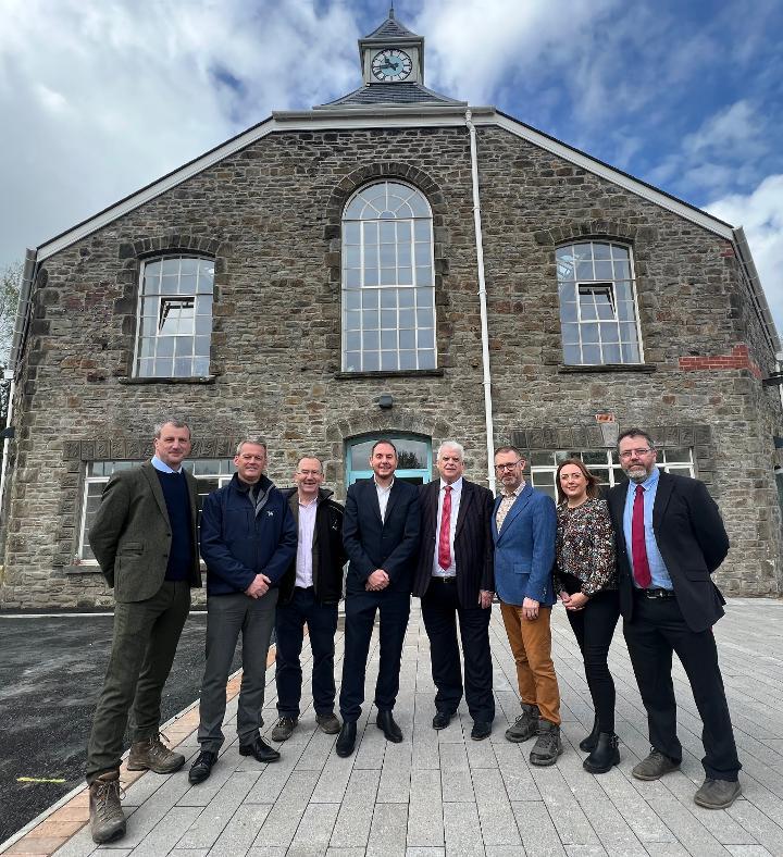 Image of Hafod Copperworks project group standing in front of the Hafod Copperworks Distillery building