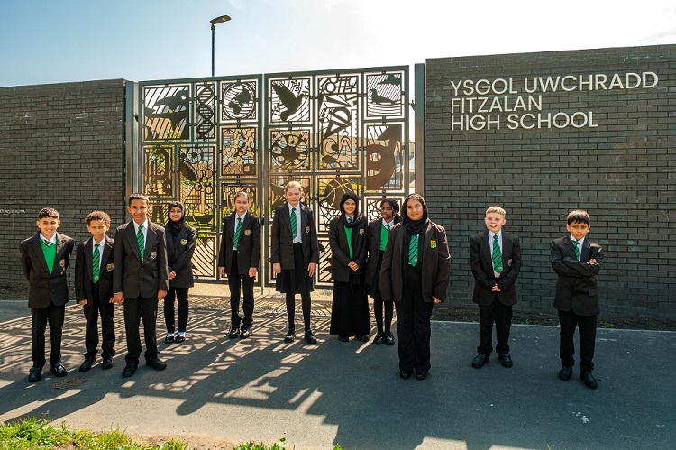 Students standing in front of Fitzalan High School in Wales