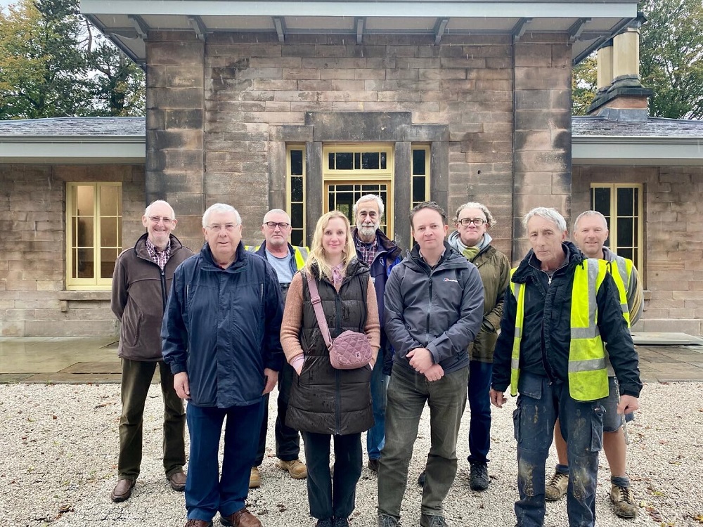 Photo of 9 people standing in front of Wingfield Station main entrance