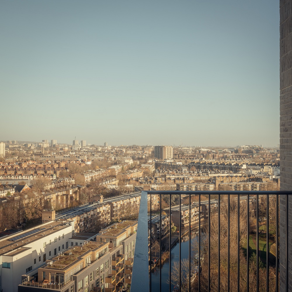 Photo taken from a high level floor of a building, overlooking a city.